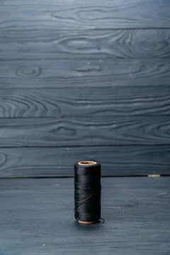 Spool of red thread dark key Stock Photos