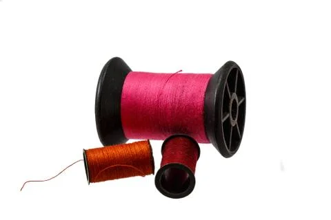Spool thread and needle isolated on white background . Stock Photos