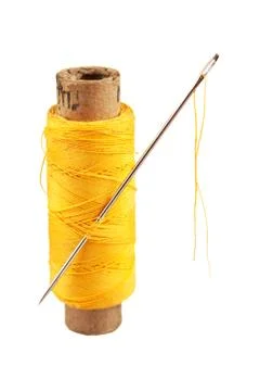 Spool of thread and needle Foto stock