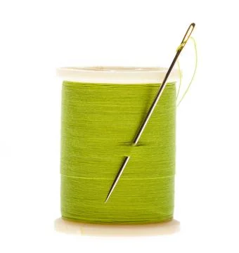 Spool of thread and needle Stock Photos