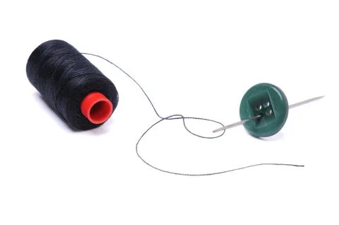 Spool of thread and needle Stock Photos