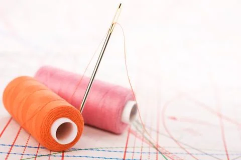 Spool of thread and needle. sew accessories. Stock Photos