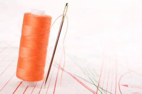 Spool of thread and needle. sew accessories. Stock Photos