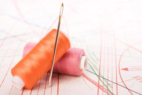 Spool of thread and needle. sew accessories. Stock Photos