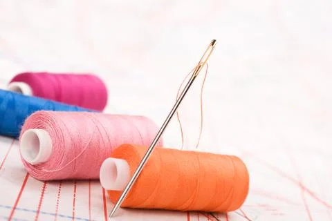 Spool of thread and needle. sew accessories. Stock Photos