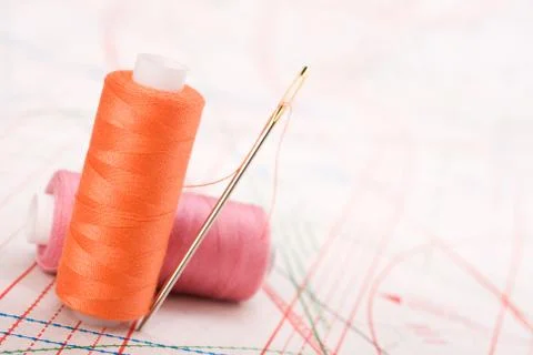 Spool of thread and needle. sew accessories. Stock Photos