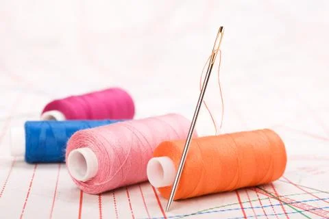 Spool of thread and needle. sew accessories. Stock Photos