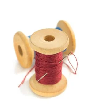 Spool of thread and needle on white Stock Photos