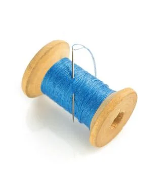 Spool of thread and needle on white Stock Photos