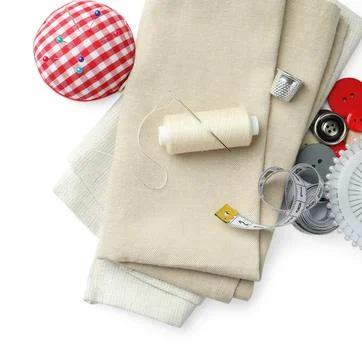 Spool of thread and sewing tools on white background, top view Stock Photos