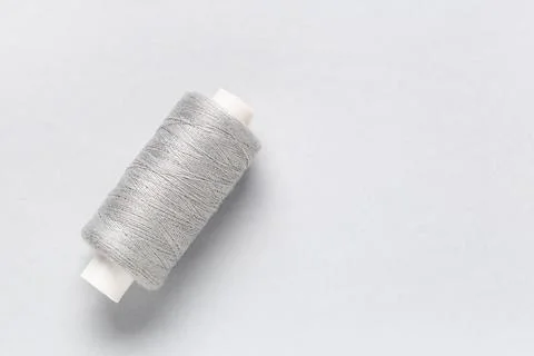 Spool of thread on grey background 写真素材