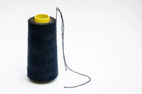 Spool of thread with needle isolate on white background Stock Photos