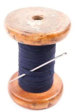 Spool of thread with needle Stock Photos