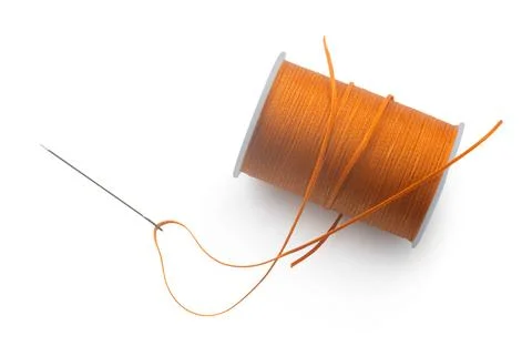 Spool of thread with a needle Stock Photos
