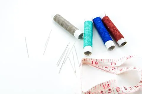 Spool of thread, needle on white background Stock Photos