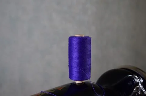 A spool of thread on a sewing machine Foto stock