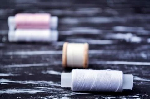 The spool of thread on the table. Thread on a reel for craft. Ma Stock Photos