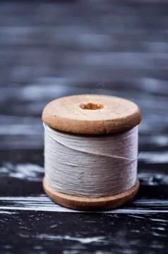 The spool of thread on the table. Thread on a reel for craft. Ma Stock Photos
