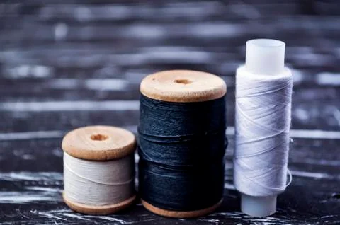 The spool of thread on the table. Thread on a reel for craft. Ma Stock Photos