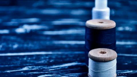 The spool of thread on the table. Thread on a reel for craft. Ma Stock Photos