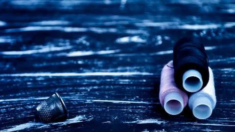 The spool of thread on the table. Thread on a reel for craft. Ma Stock Photos