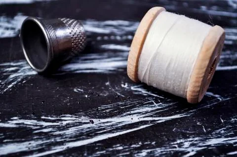 The spool of thread on the table. Thread on a reel for craft. Ma Stock Photos