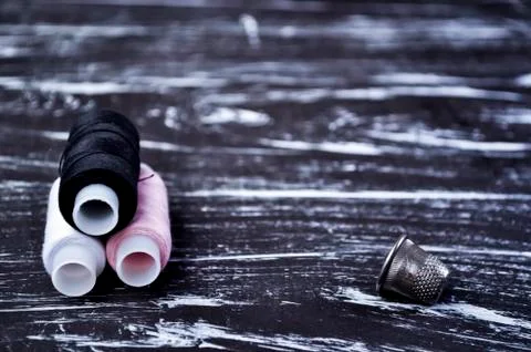 The spool of thread on the table. Thread on a reel for craft. Ma Stock Photos