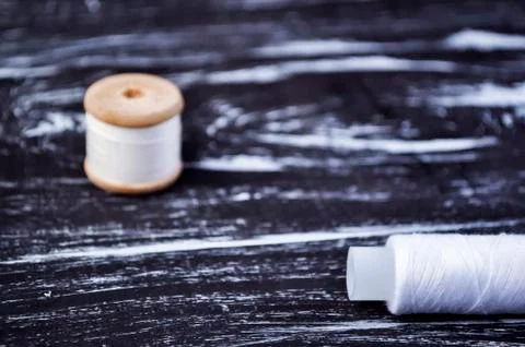 The spool of thread on the table. Thread on a reel for craft. Ma Stock Photos