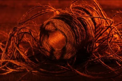 Spool of thread on wooden surface 写真素材