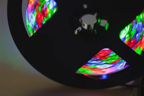 A spool with vibrant multicolor LED lights, close up Stock Photos
