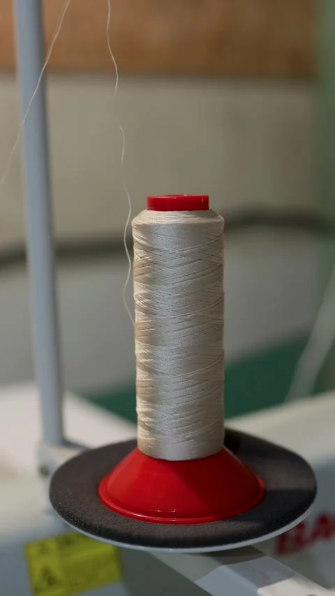 Spool of White Thread on Sewing Machine Stock Footage 329325781