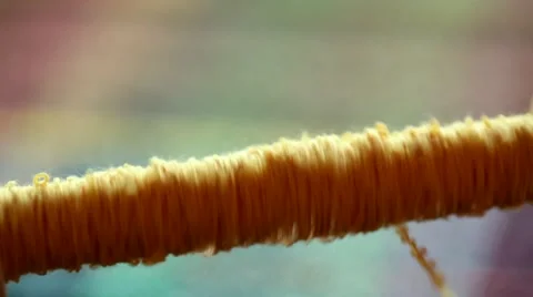 Spooling yarn onto a weaving spindle Stock Footage 48717892