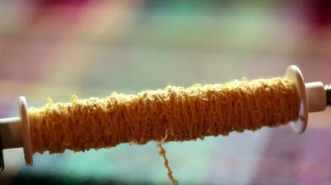 Spooling yarn onto a weaving spindle Stock Footage 48718005