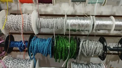 Spools Of Beaded Chain And Threads Foto stock