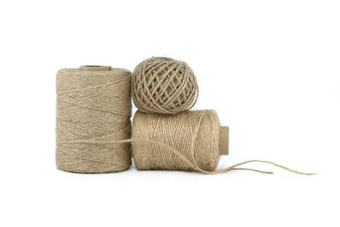 Spools of burlap threads or jute twine isolated on white background. Eco 写真素材