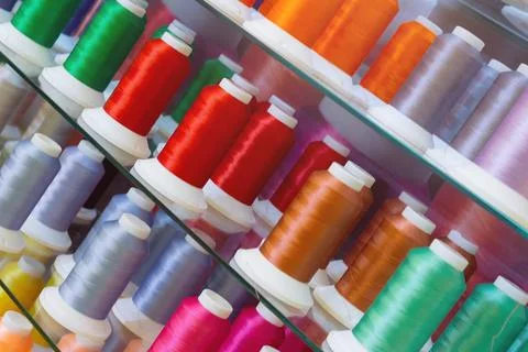 Spools of colored thread for sewing machine Stock Photos