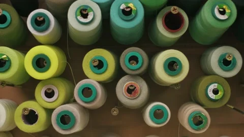 Spools of colored thread on a vertical stand. Stock Footage 152097850
