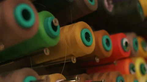 Spools of colored thread on a vertical stand. 스톡 동영상 152097897
