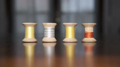 Spools of colored threads for sewing above tailor's table Stock Footage 148059562