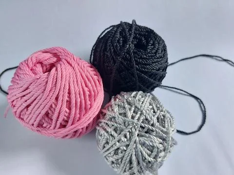 Spools of colorful knitting threads Stock Photos