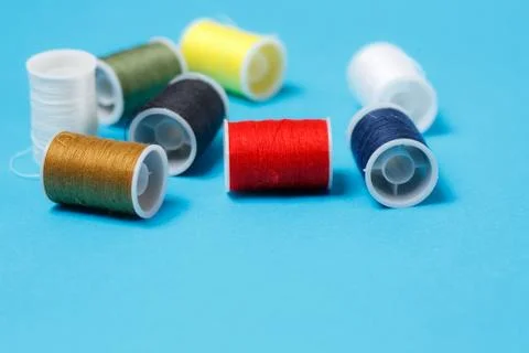 Spools of Colorful Thread on Neutral Background Stock Photos