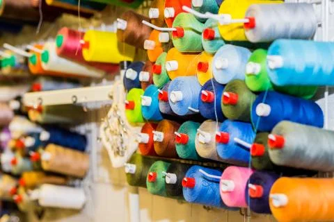 Spools of colorful Thread in sewing Studio.Selective focus.Colorful embroidery Stock Photos