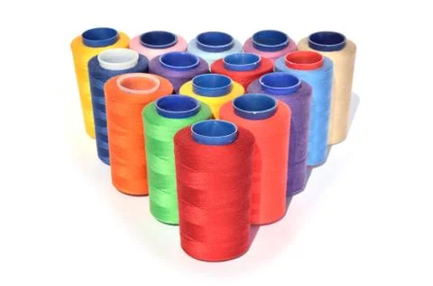 Spools of colorful threads Stock Photos