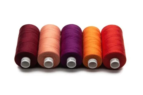 Spools of colours threads isolated on white background Stock Photos