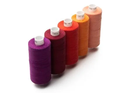 Spools of colours threads isolated on white background Stock Photos