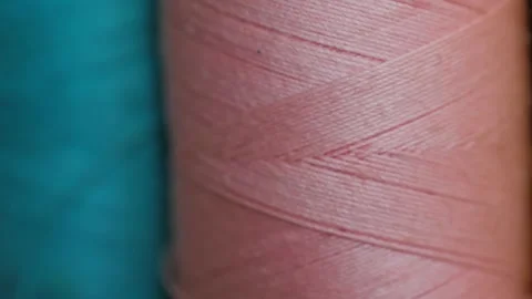 Spools of cotton thread for sewing in different colors close-up 動画素材 281590442