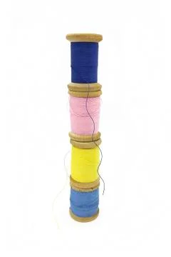 Spools of multi-colored threads on a white background Stock Photos