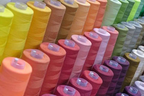 Spools of multi-coloured cotton threads Stock Photos