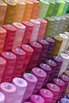 Spools of multi-coloured cotton threads Stock Photos