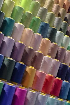 Spools of multi-coloured cotton threads Stock Photos